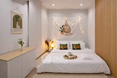 Cozy modern bedroom with stylish decor and ambient lighting, perfect for relaxation and comfort.