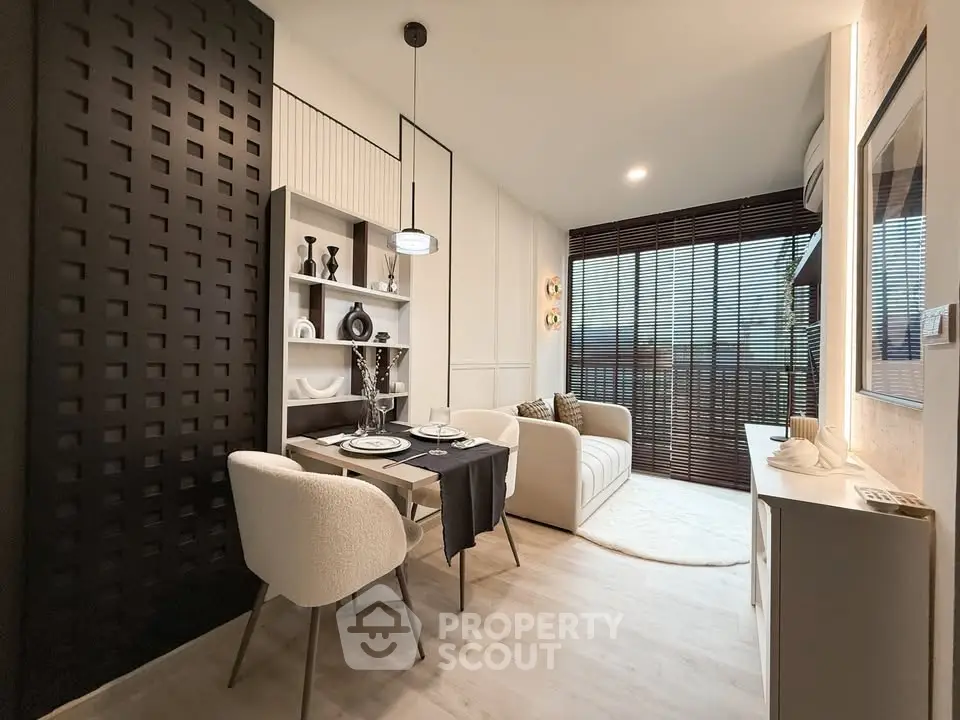 Modern living room with elegant decor and large window blinds