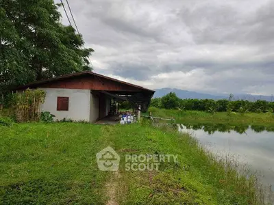 Charming rural property with serene pond and lush greenery, perfect for nature lovers seeking tranquility.