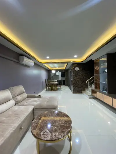 Luxurious living room with modern decor and elegant lighting