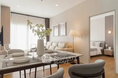Modern open-plan living and dining area with elegant decor and natural light.