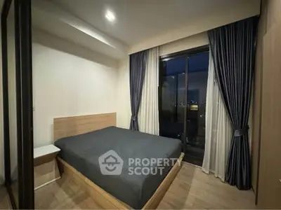 Modern bedroom with city view, featuring sleek design and floor-to-ceiling windows for a luxurious living experience.