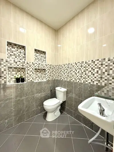 Modern bathroom with stylish tile design and sleek fixtures