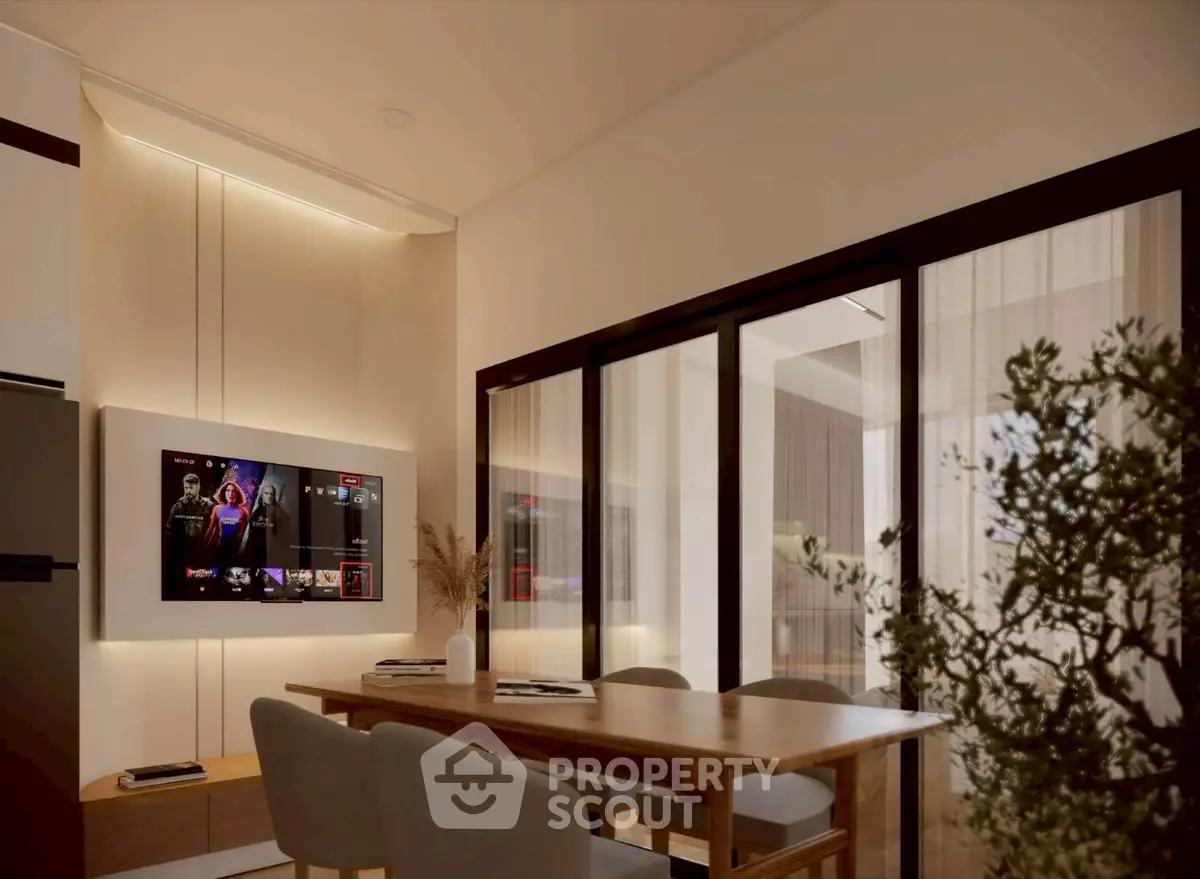 Modern dining area with sleek furniture and wall-mounted TV in stylish apartment.