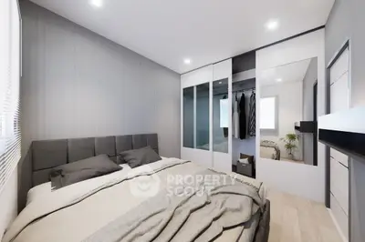 Modern bedroom with sleek design and mirrored wardrobe