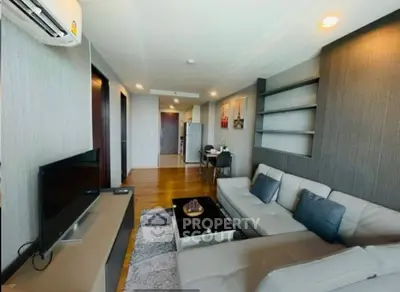 Modern living room with stylish decor and open layout in a contemporary apartment.