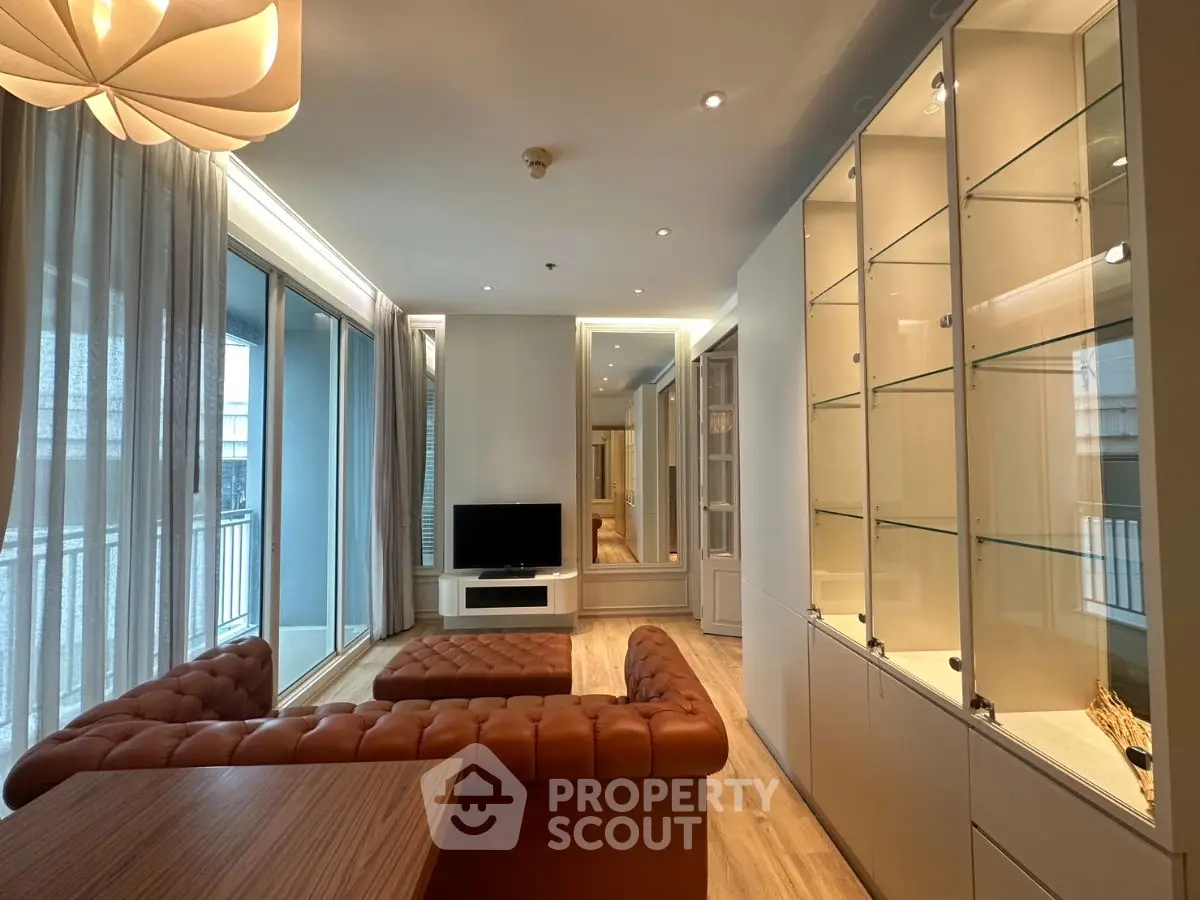 Luxurious living room with elegant furniture and large windows in modern apartment