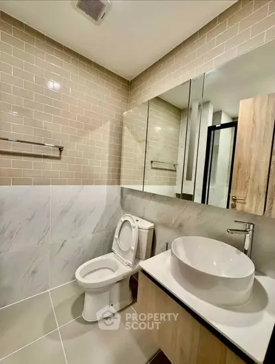 Modern bathroom with stylish fixtures and elegant tile design
