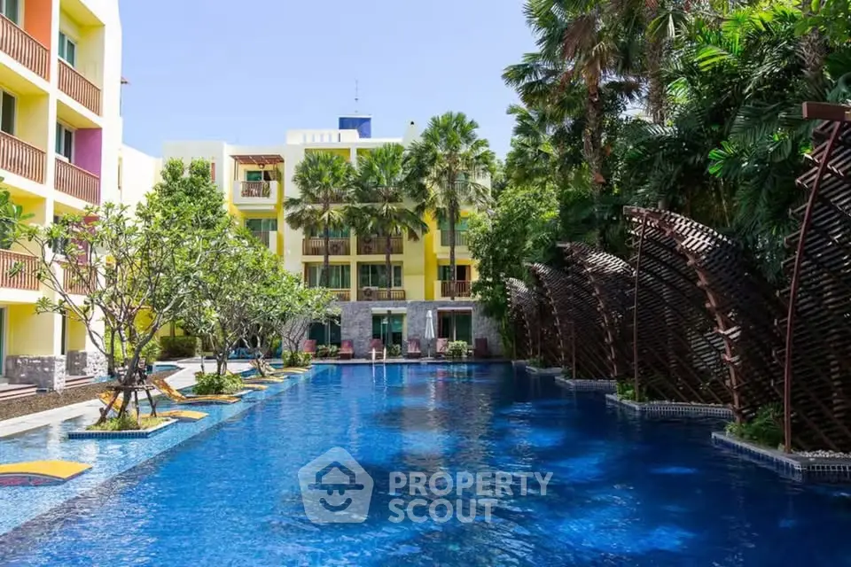 Luxurious resort-style pool with lush greenery and modern architecture