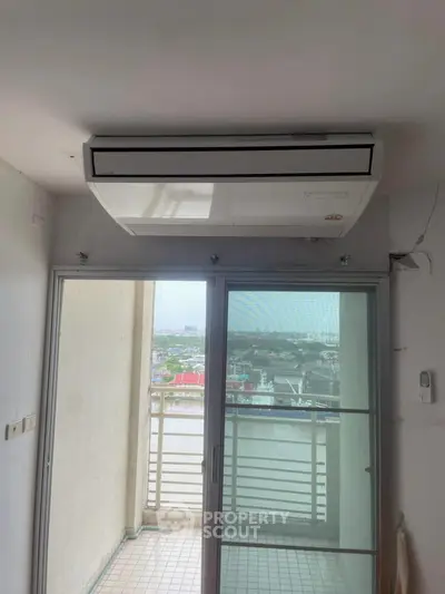 Modern apartment balcony with air conditioning and city view
