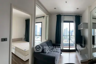 Modern apartment with city view, featuring cozy living room and bedroom with large windows.