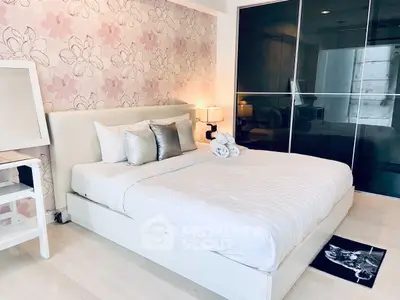 Chic modern bedroom with floral wallpaper and sleek sliding closet doors.