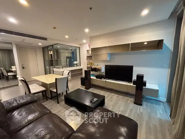 Modern living room with sleek furniture and open layout, perfect for entertaining guests.