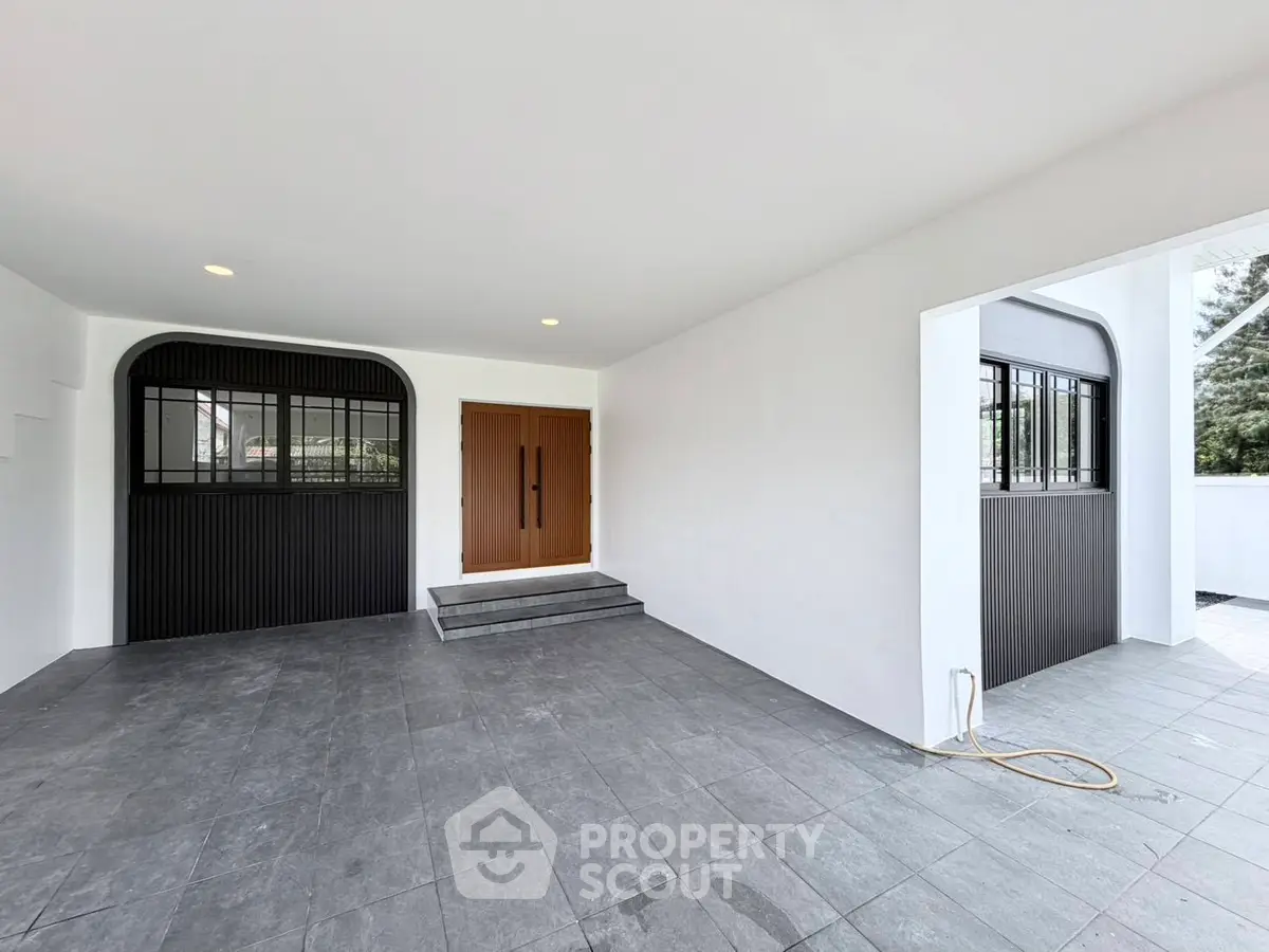 Spacious modern entrance with sleek design and ample natural light