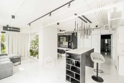 Stunning modern living room with sleek design and open layout, featuring elegant lighting and stylish furniture.