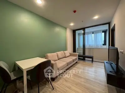 Modern living room with cozy sofa and dining area in stylish apartment