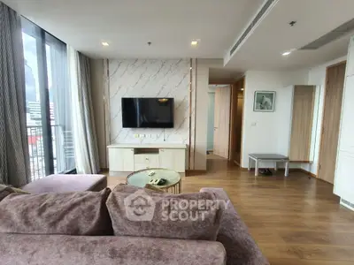 Spacious modern living room with large windows and stylish decor