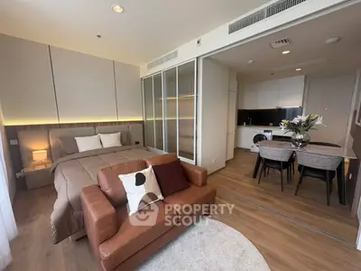 Modern studio apartment with cozy living area and stylish kitchen