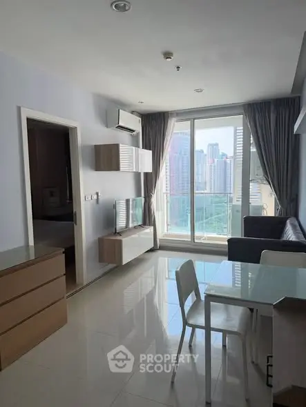 Modern living room with city view and sleek furniture in high-rise apartment