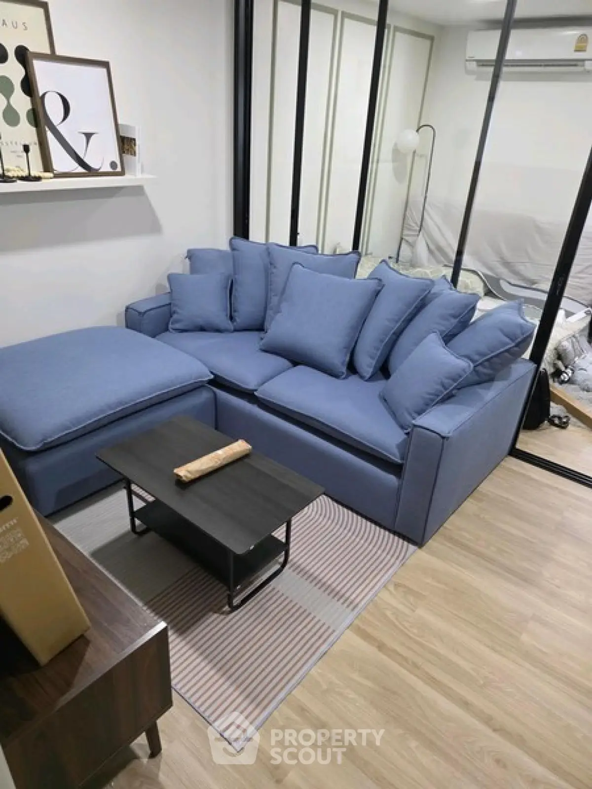 Cozy living room with modern blue sofa and stylish decor