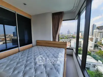 Modern bedroom with panoramic city view and large windows