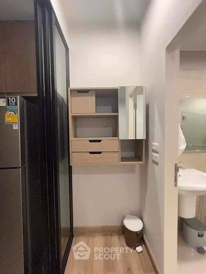 Compact kitchen corner with modern shelving and sleek design