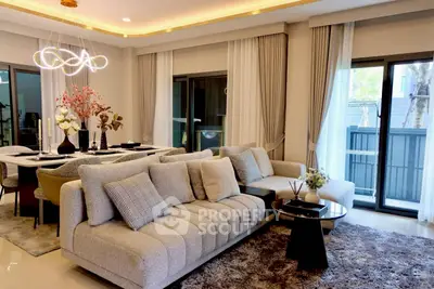 Luxurious modern living room with elegant decor and large windows