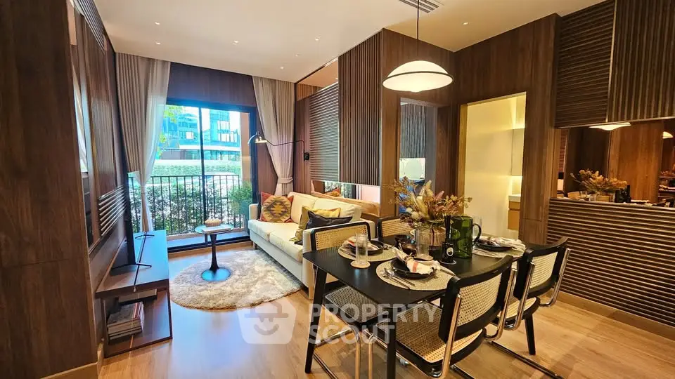 Modern living room with dining area, stylish decor, and large window view