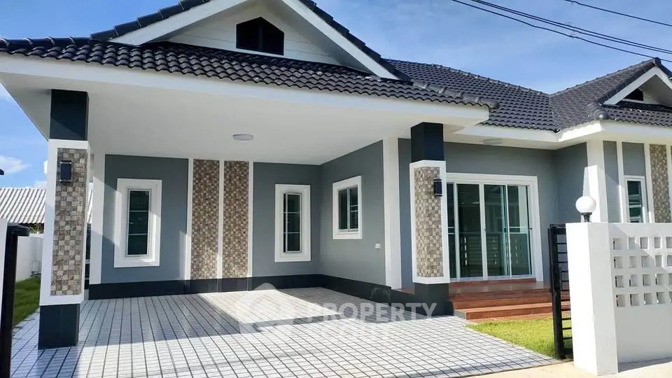 Charming modern house with tiled driveway and stylish facade