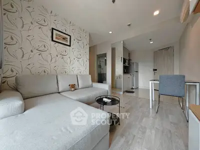 Modern living room with stylish decor and open kitchen layout