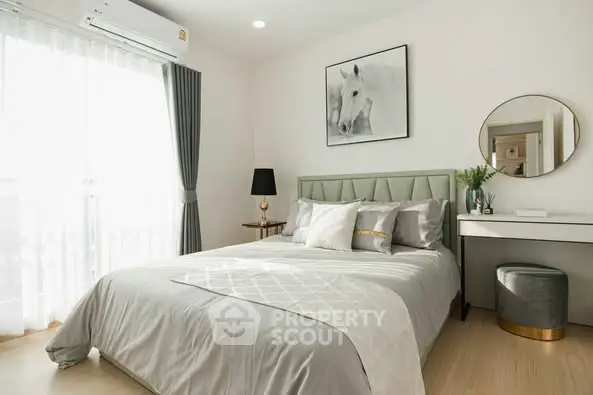 Elegant bedroom with stylish decor and natural light