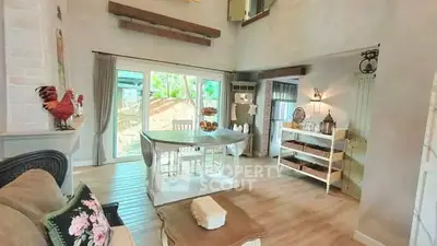 Charming rustic living room with wooden floors and large windows