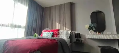 Stylish bedroom with modern decor and ample natural light