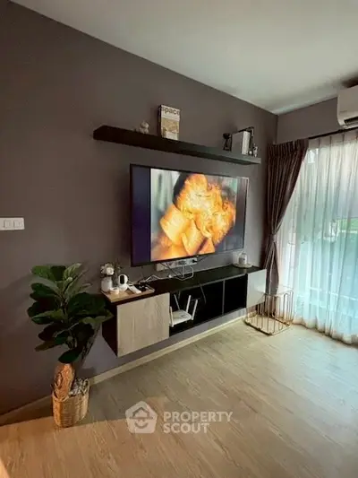 Modern living room with wall-mounted TV and stylish decor