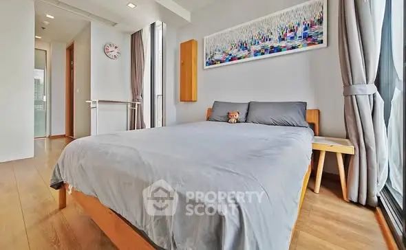 Modern bedroom with large windows and stylish decor