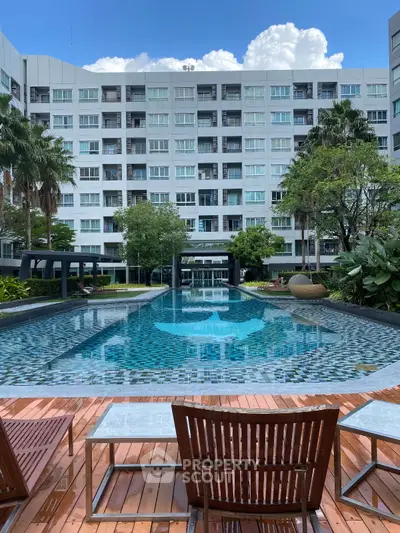 Luxurious condominium with stunning pool and lush garden views, perfect for relaxation and leisure.