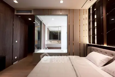 Luxurious bedroom with modern design and integrated bathtub for ultimate relaxation.
