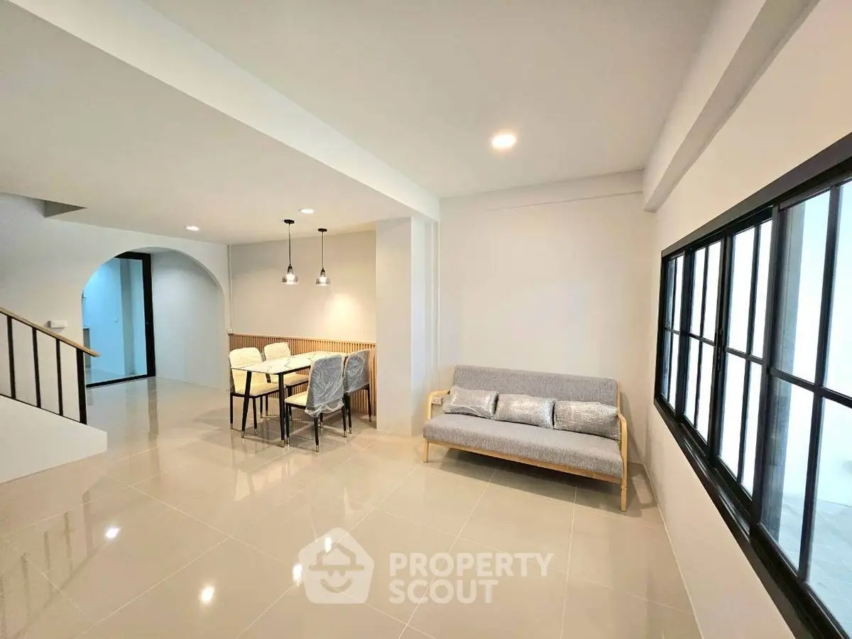 Spacious modern living room with dining area and stylish furniture