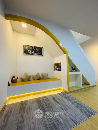 Stylish modern living room with unique architectural design and cozy seating area.