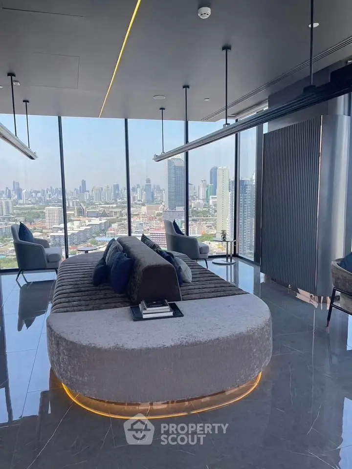 Luxurious modern living room with panoramic city view and elegant furnishings.