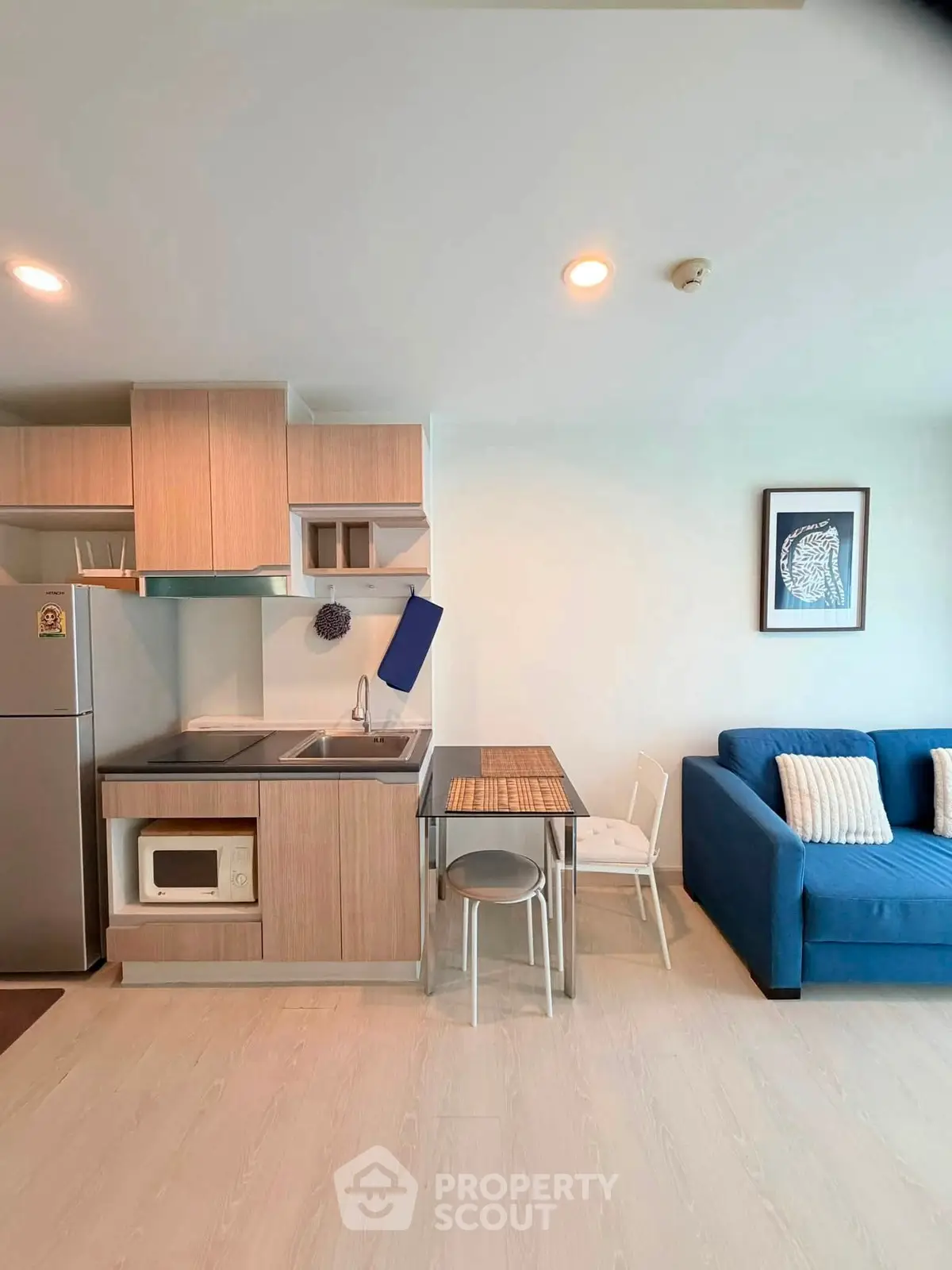 Modern apartment interior with compact kitchen and cozy living area