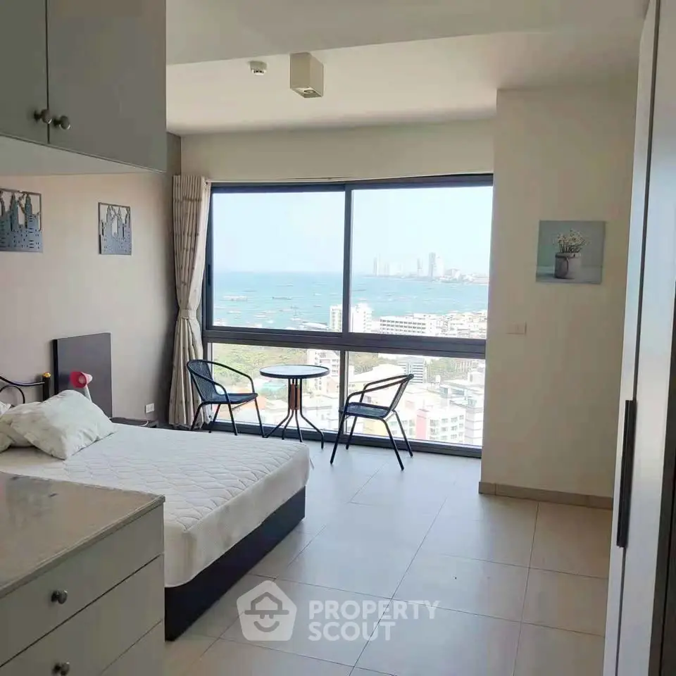 Spacious bedroom with stunning ocean view and modern decor