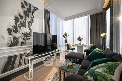 Luxurious modern living room with elegant decor and large windows offering stunning views.