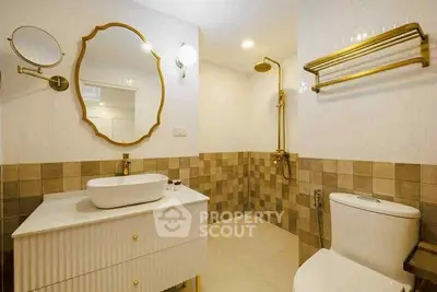Luxurious bathroom with elegant gold fixtures and modern design