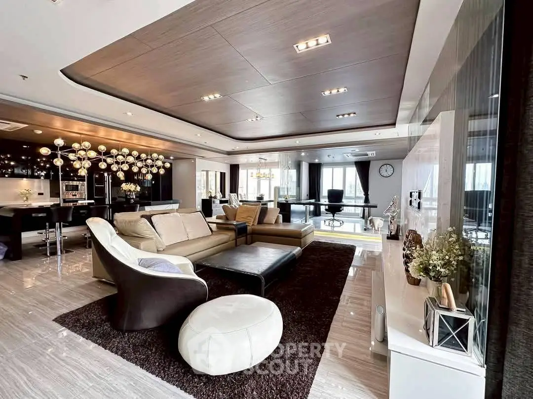 Luxurious open-plan living room with modern decor and elegant lighting