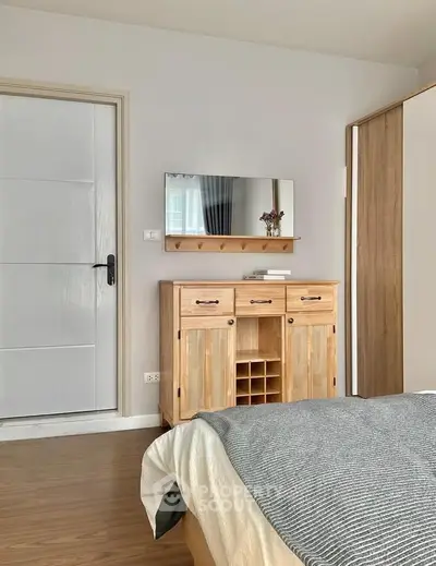 Cozy bedroom with wooden furniture and stylish decor