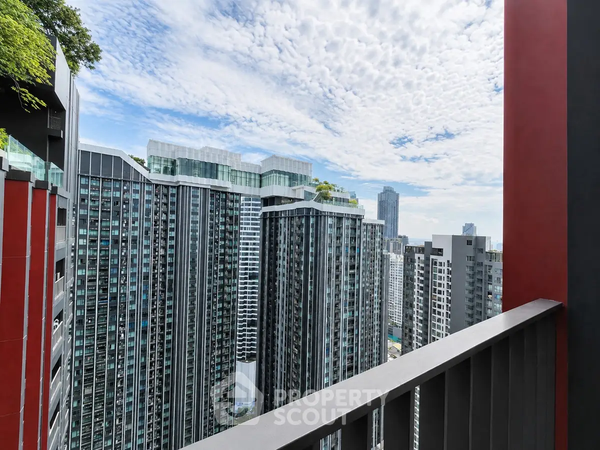 Stunning cityscape view from a modern high-rise balcony, showcasing sleek architecture and urban skyline.