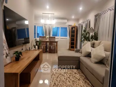 Stylish modern living room with cozy sectional sofa and elegant dining area