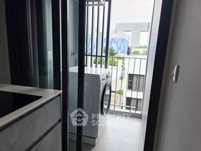 Modern apartment balcony with washing machine and city view