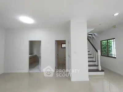 Spacious modern interior with staircase and natural light